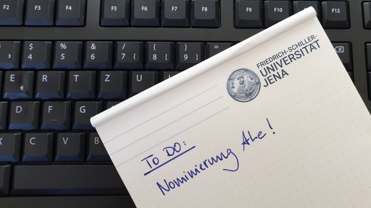 notepad with a reminder of the nomination of candidates for the ALe