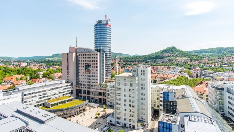 Campus of the university, in the background the green mountains of the city.