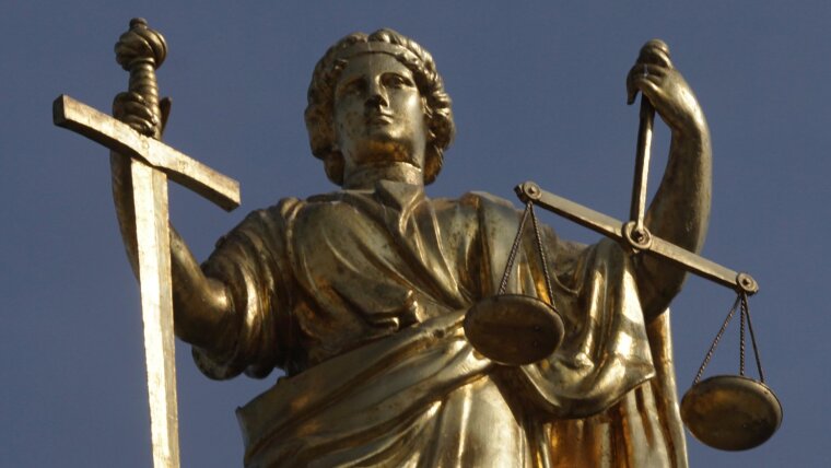 Gilded figurine of the goddess of law and justice