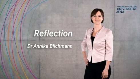 placeholder image — Dr Annika Blichmann in front of a grey wall, next to her is the keyword reflection.