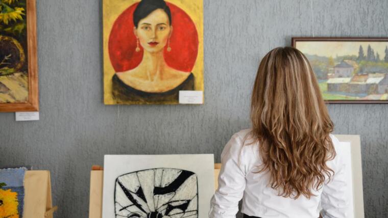 Student looks at a painting
