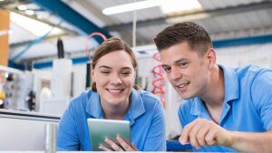 Two people check processes