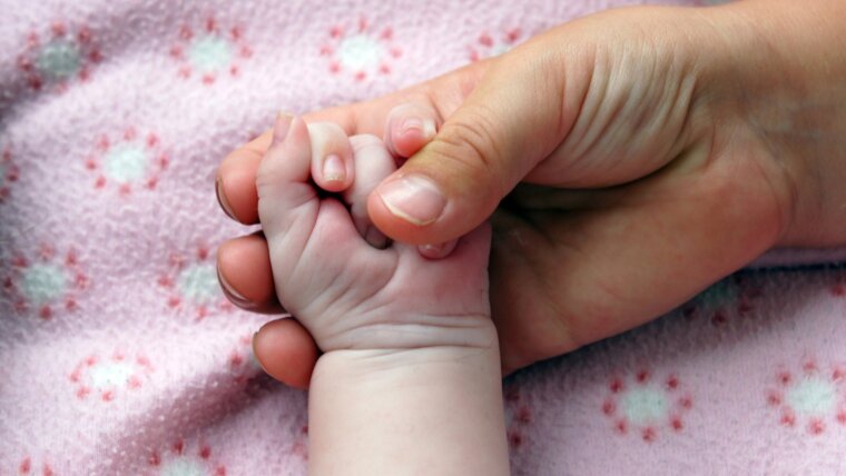 Mother and child hands