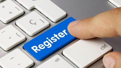 Finger pointing at a key named "register"