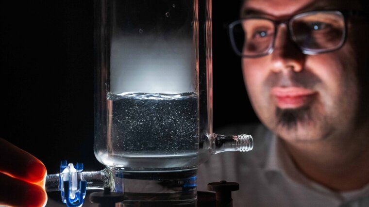 Dr Patrick Bräutigam experiments on a reactor for combining ultrasound and ozonation.