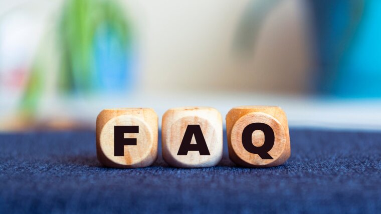 Three adjacent dice that show the letters F, A and Q.