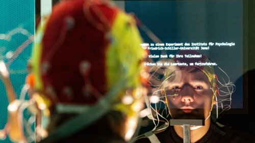 A person with an EEG cap.