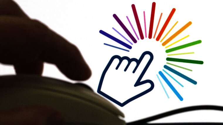 Ein Finger auf einer Computermaus und im Hintergrund auf einem Bildschirm bunte Farben, die Vielfalt symbolisieren sollen.