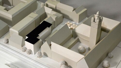 One of the two communication centers will be built next to the university main building (dark block).