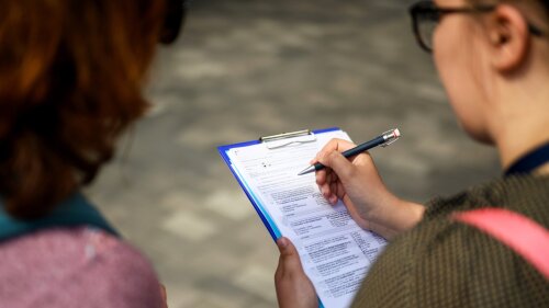 A student interviews a person
