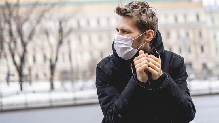 Man with mouth-nose cover