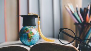 Graduation cap with Earth globe