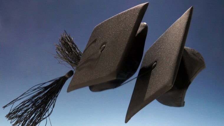 two doctoral hats