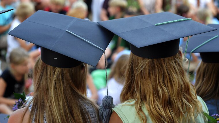 schoolgirls with a doctoral cap