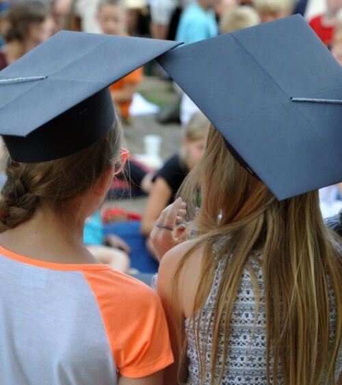 schoolgirls with a doctoral cap