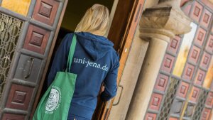 A student enters the university main building