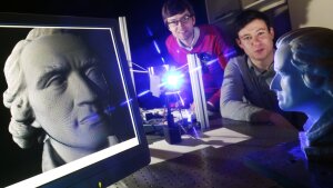 Two men in an optical laboratory