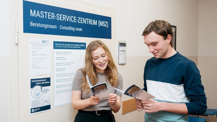 Prospective students read the brochure on the range of courses