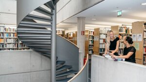 Students talking in the library