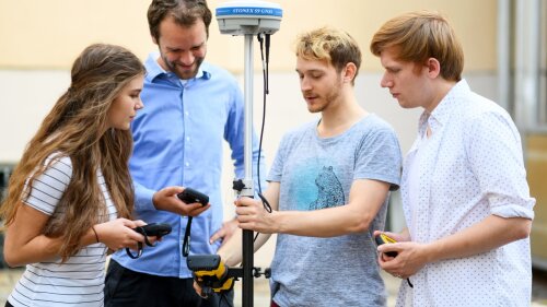 students with a GPS device