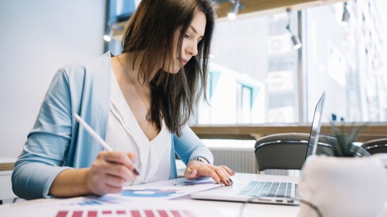 Female student draws up diagrams and makes calculations