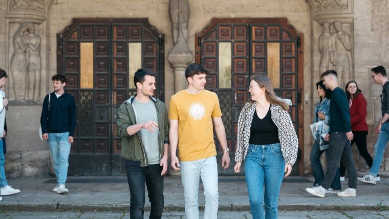 Students in front of the university main building