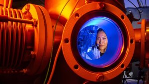 Doctoral candidate Karla Jahaira Paz Corrales experiments with material samples at an ion accelerator.