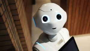 A robot with a friendly expression looks at the viewer.