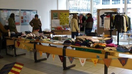 Stand with clothes for exchange in the reception area of the University of Jena