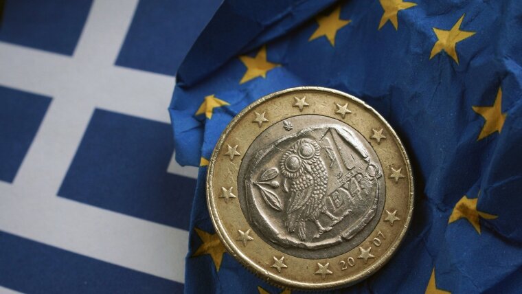 Image: Greek euro coin lies on flags of the EU and Greece