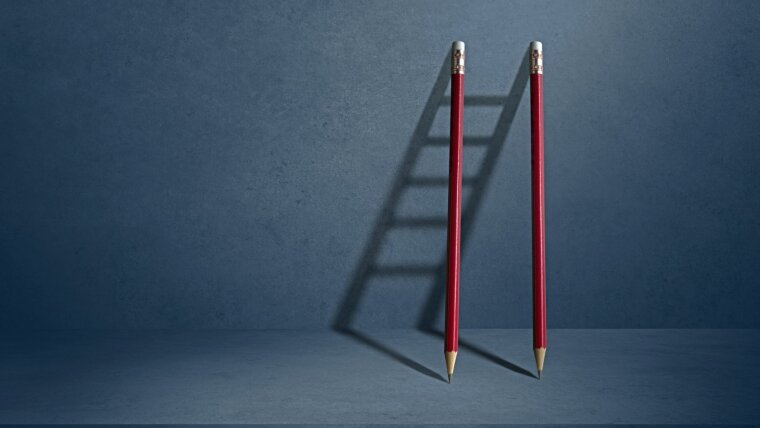 Two pencils’ shadows forming an upward ladder—a guide to independence?