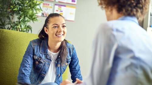 Doctoral candidate talking with her supervisor