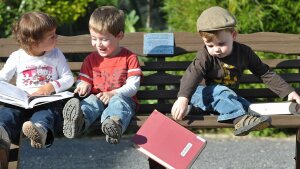 Children of doctoral candidates playing with books