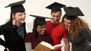 Doctoral candidates with doctoral hats